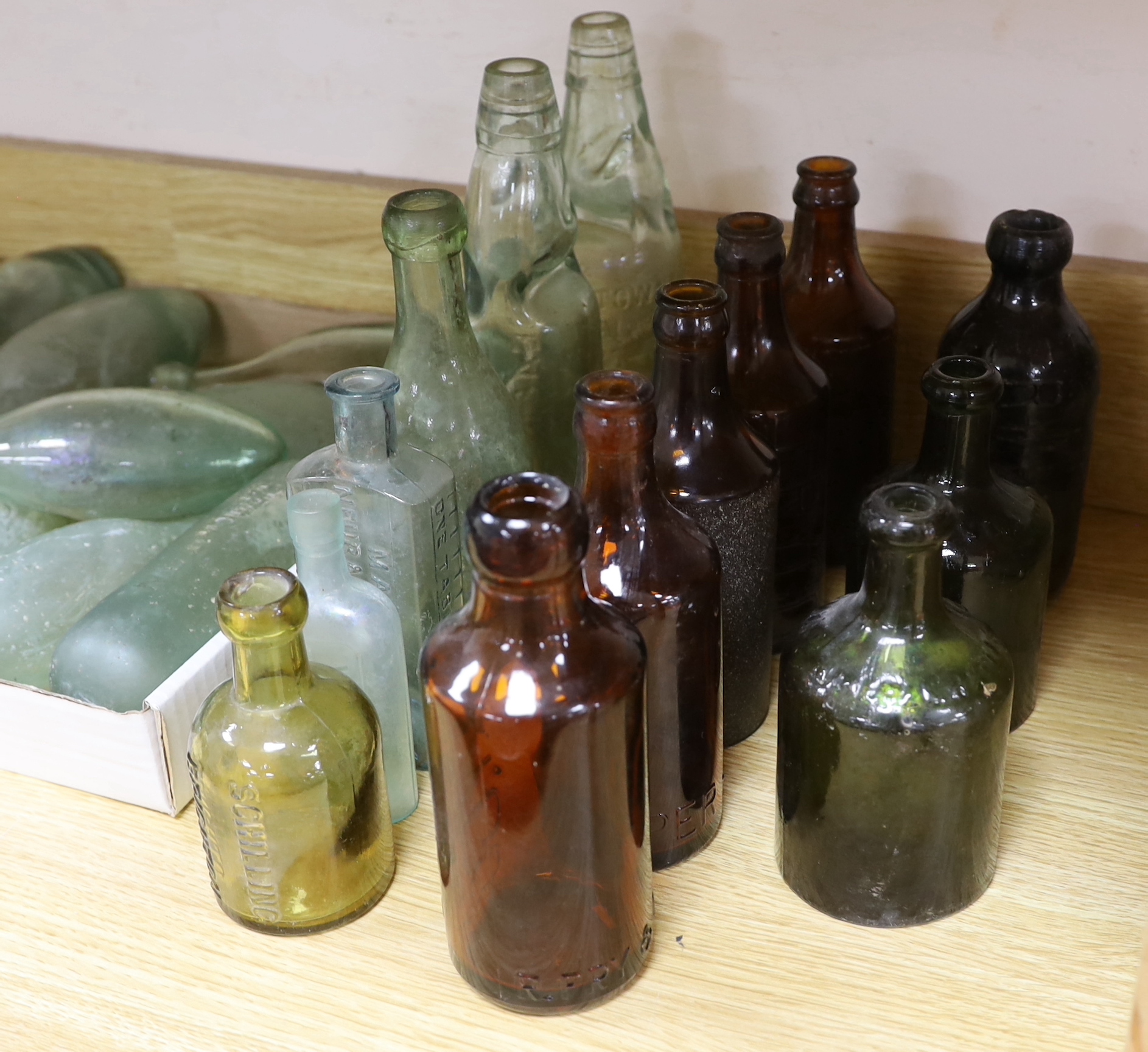 A quantity of early to mid 20th century glass bottles